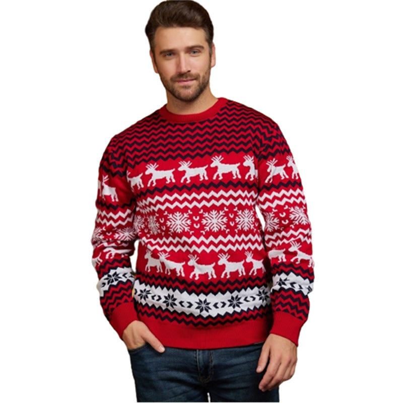 Man wearing a red Christmas sweater with reindeer and snowflake pattern on a white background