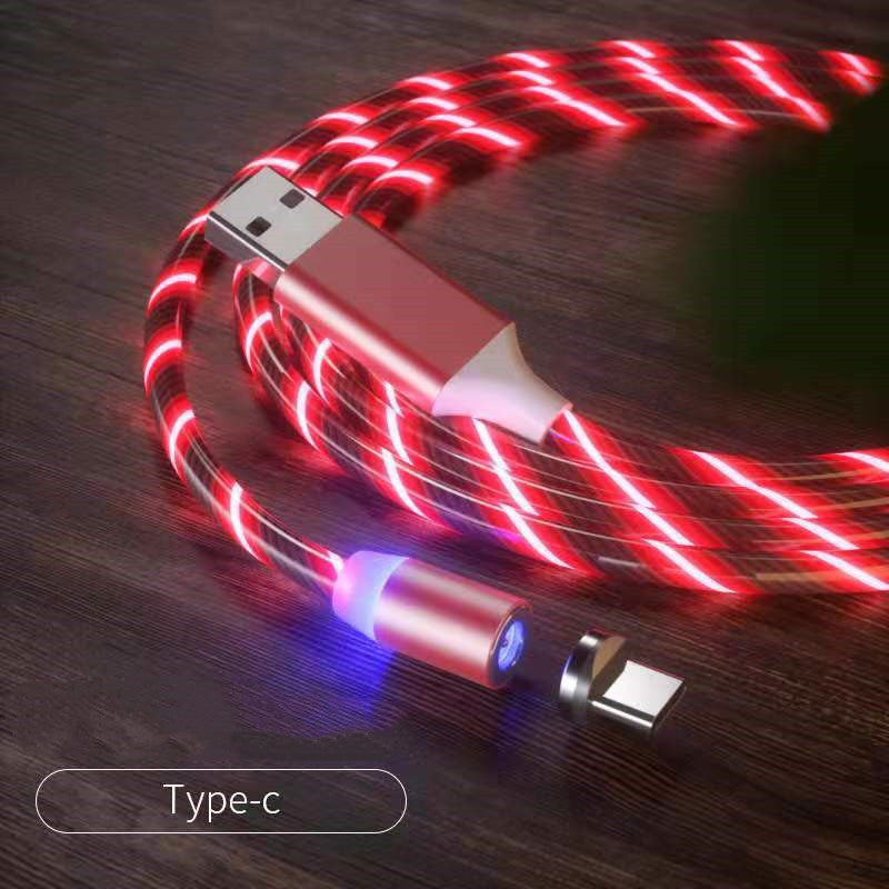 USB cable with LED lighting on a wooden surface