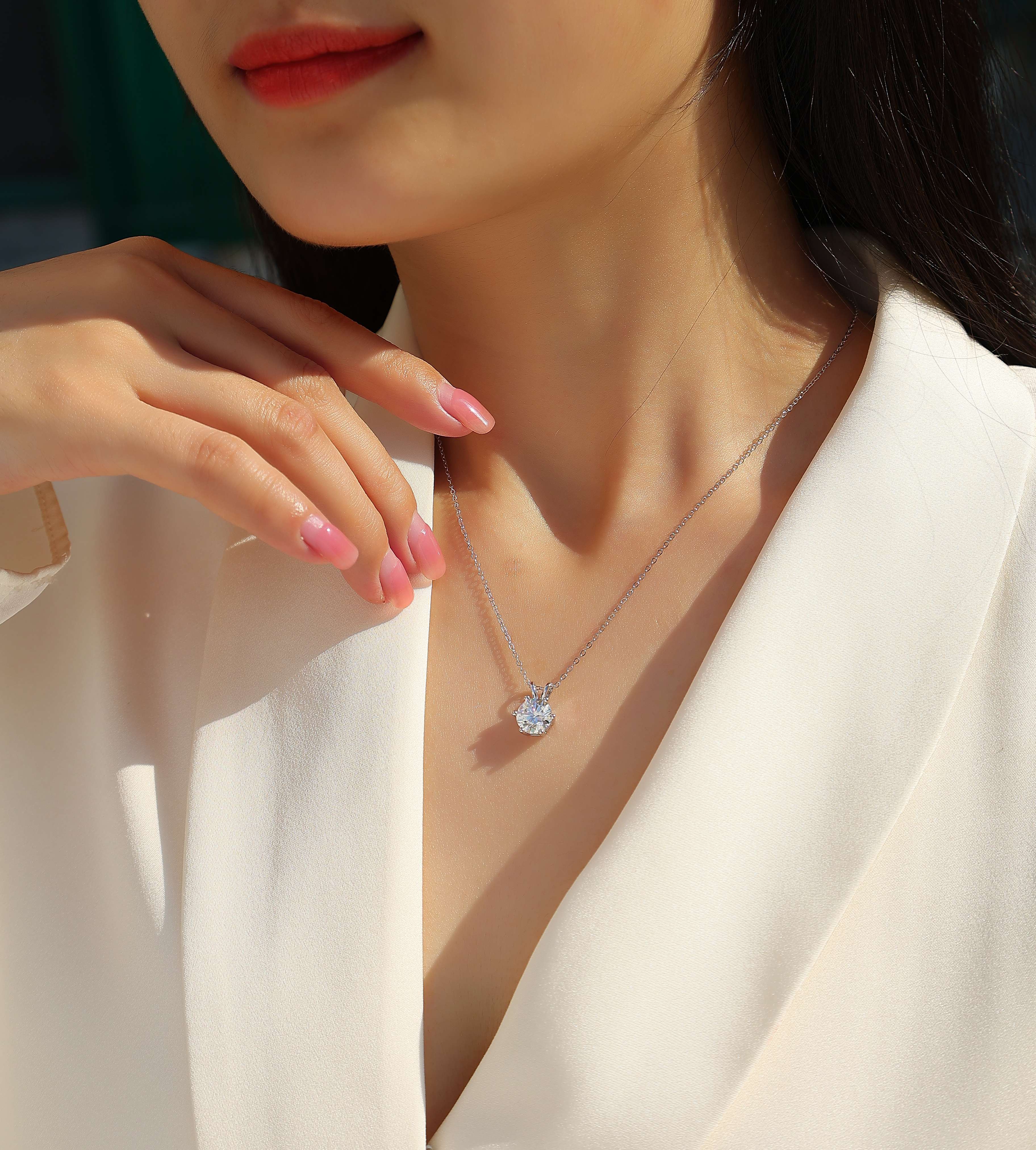 "Elegant woman wearing a 2 carat Moissanite necklace for a luxury party look"