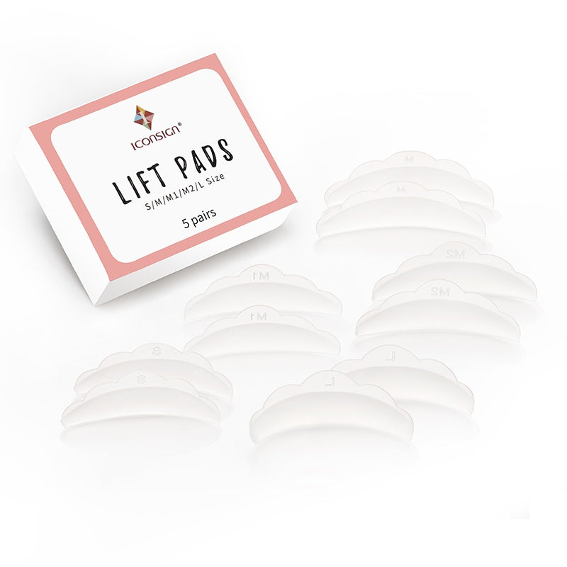 Box of lift pads with multiple pads displayed in front on a white background