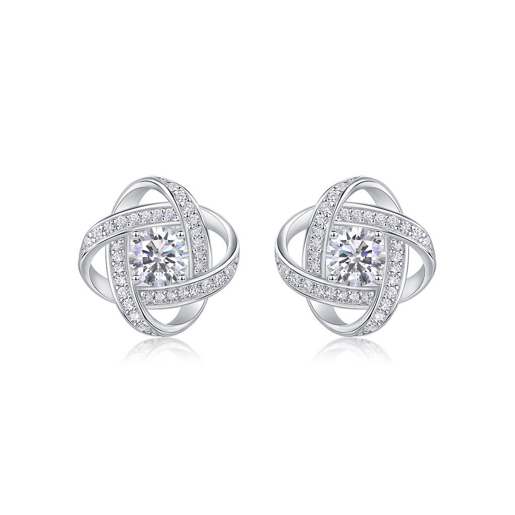 Pair of silver earrings with interlocking design and clear gemstones on a white background