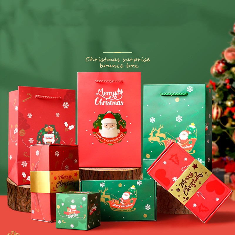 Premium collection of red and green Christmas surprise gift boxes and packaging bags, including small bounce boxes