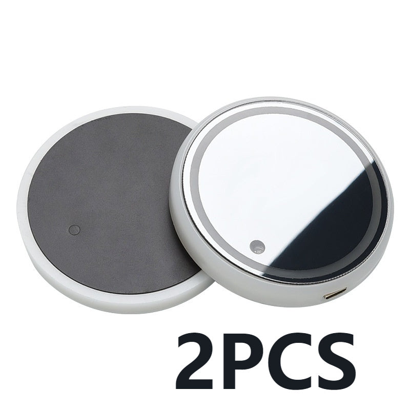 Two round magnetic buttons with one gray and one silver, on a white background.